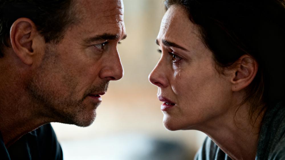 A couple looking into each other's eyes while talking, demonstrating how to intimacy for couples involves active and deep listening.