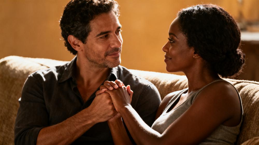 A diverse couple tenderly holding hands, illustrating the core concept of physical intimacy how to build a stronger connection.